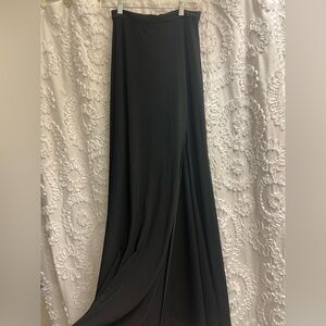 Women’s black long black skirt with slit in the front size 4